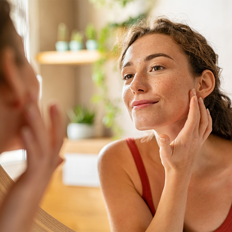 woman looking her face